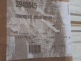 a cardboard box with a picture of a plane on it
