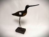 an image of a wooden bird on a stand on a white background