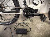 a bike that is connected to a charger on the ground