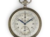a close up of a pocket watch on a white background