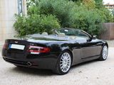 a black sports car parked in front of a building