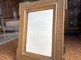 a picture of a mirror on the floor in a living room