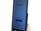 the back of a phone that is sitting on top of a stand