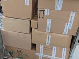a cart full of boxes sitting on the sidewalk