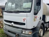a white truck that is parked on the side of the road
