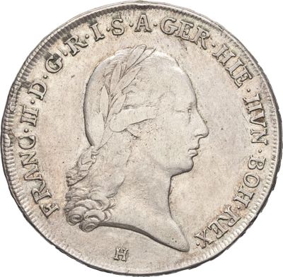 gros plan d'une pièce de monnaie sur laquelle figure une tête de femme
