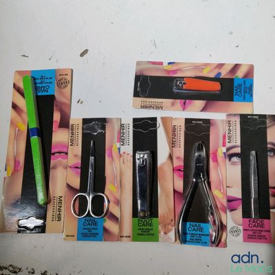 five different types of scissors and a pair of scissors