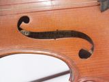 a close up of a violin with a label on it