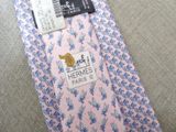 a pink neck tie with blue flowers on it