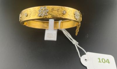 an image of a close up of a gold bracelet with a price tag