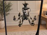 a chandelier hanging from the ceiling in a living room