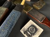 many different types of knives on a table