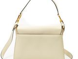 a white handbag with a gold handle on a white background