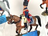 five figurines of soldiers riding horses on display
