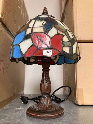 a lamp that is sitting on a table next to a box