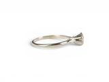 an image of a silver ring with a bow on it