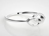 silver plated ring with a horseshoe and crystal stones on it