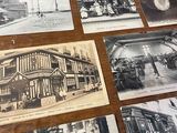 many old black and white photos of people on the table