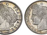 a silver coin with an image of a woman ' s head on it