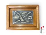 a picture of a picture of a clock made of metal