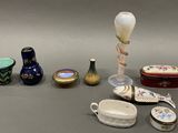 many different types of vases and bowls on the table