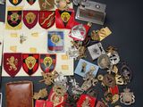 a lot of badges and other items that are on a table