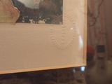 a picture of a cat that is sitting in a picture frame