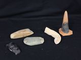 several different types of rocks and stones on a black background