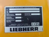 a label on the back of a yellow machine