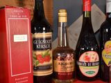 several bottles of wine are lined up on a table