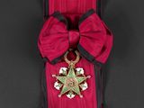 an image of a red ribbon with a star and a star on it
