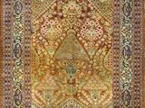 an antique persian rug with a medallion design on a pink ground