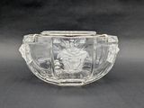 a clear glass bowl with a picture of a woman on it
