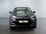 the front of a black citrole parked in a white room