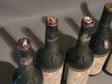 several bottles of wine are lined up on a table