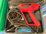 a tool in a case that is sitting on the floor