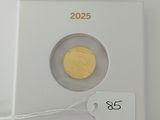 a close up of a coin in a white box with a price tag
