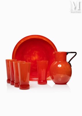 a lot of red glassware sitting on a white surface
