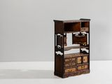a small wooden cabinet with drawers and drawers on top