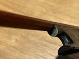 a close up of a wooden handle on a wooden table
