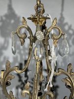 Lustre électrifié en bronze à huit bras de lumière dans le g… (photo 3)