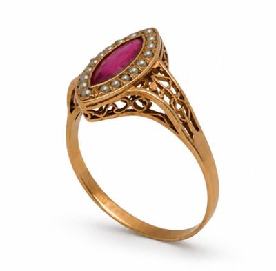 a gold ring with a ruby stone and diamonds