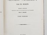 two open books on a table with a white background