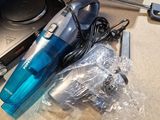 a vacuum cleaner and other items sitting on a counter