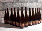 bottles of wine lined up in a row on a table