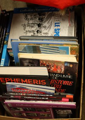 a box full of books sitting on the floor