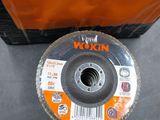 the disc is sitting on the table next to the orange box