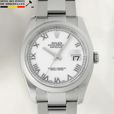a close up of a wrist watch with roman numerals on it