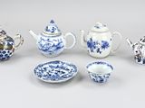 several pieces of blue and white porcelain teapots and bowls