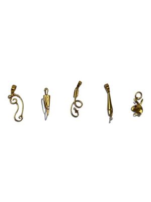 five different types of earrings on a white surface